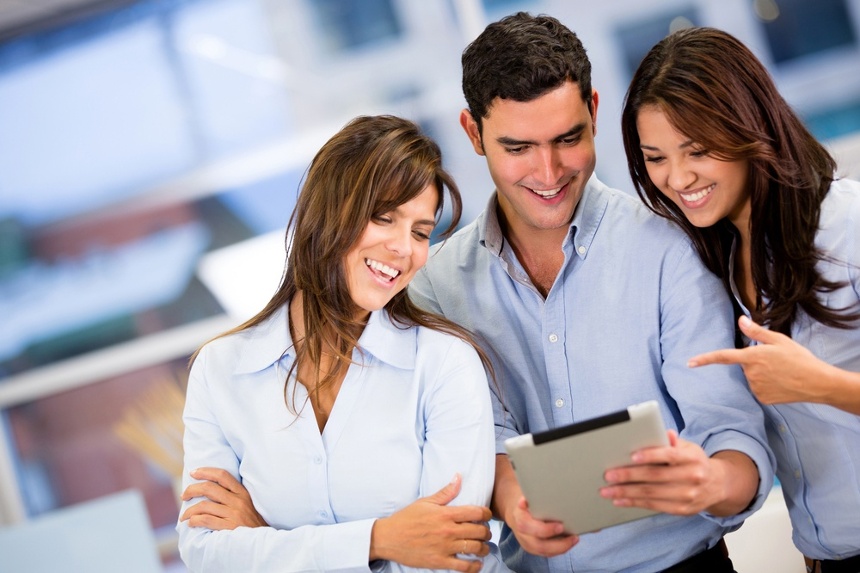 Group of business people working with a tablet computer