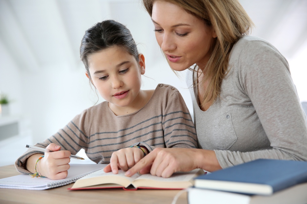 Mom helping kid with homework-1