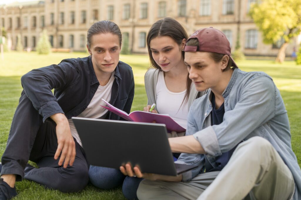 group of teenagers discussing university project scaled